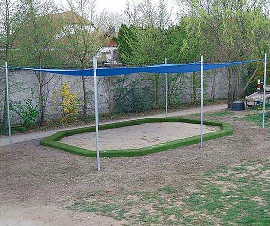 Sandkastenumrandung aus Blockstufen